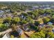Aerial view of the property showcasing its location in the neighborhood with mature tree coverage at 721 Ne 2Nd St, Ocala, FL 34470