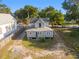 Aerial view shows the home from the back, including the roof, siding, and driveway at 721 Ne 2Nd St, Ocala, FL 34470