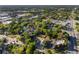 A stunning aerial view shows a charming neighborhood with lush greenery and a serene lake nearby at 721 Ne 2Nd St, Ocala, FL 34470