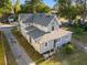 Aerial view of a two-story home showing the back exterior and surrounding yard at 721 Ne 2Nd St, Ocala, FL 34470