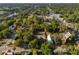 An eye-level aerial view showcases the town, highlighting the water tower and tree-lined streets at 721 Ne 2Nd St, Ocala, FL 34470