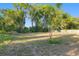 Lush backyard with ample space, offering a tranquil setting for outdoor activities and relaxation at 721 Ne 2Nd St, Ocala, FL 34470