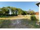 Backyard area with abundant space for landscaping or recreation, plus views of neighboring buildings at 721 Ne 2Nd St, Ocala, FL 34470