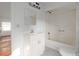Clean bathroom featuring a tub with shower, vanity, and mirror at 721 Ne 2Nd St, Ocala, FL 34470