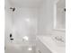This bright bathroom features a sink, vanity, mirror, shower, and a tub at 721 Ne 2Nd St, Ocala, FL 34470