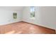 This airy bedroom features hardwood floors and natural light at 721 Ne 2Nd St, Ocala, FL 34470
