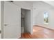 Bright bedroom featuring wood floors and natural light from the window at 721 Ne 2Nd St, Ocala, FL 34470
