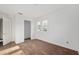 Spacious bedroom featuring hardwood floors, a window, and a closet at 721 Ne 2Nd St, Ocala, FL 34470
