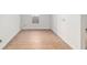 A bright bedroom with hardwood floors and a large window allowing for natural light at 721 Ne 2Nd St, Ocala, FL 34470