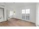 Bright bedroom with a large window and doorway to an adjoining room at 721 Ne 2Nd St, Ocala, FL 34470