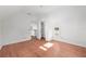 Bright bedroom features wood floors, closet, and window offering natural light at 721 Ne 2Nd St, Ocala, FL 34470