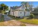 Charming exterior with a side view, showcasing the home's architecture and inviting ambiance at 721 Ne 2Nd St, Ocala, FL 34470