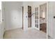 Hallway featuring doors leading to various rooms and storage spaces at 721 Ne 2Nd St, Ocala, FL 34470