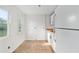 Bright, unfinished kitchen features a window and a new fridge at 721 Ne 2Nd St, Ocala, FL 34470