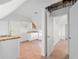 New kitchen area featuring white cabinets, butcher block counters and hardwood floors at 721 Ne 2Nd St, Ocala, FL 34470