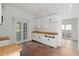 Spacious kitchen area featuring white cabinets and butcher block countertops at 721 Ne 2Nd St, Ocala, FL 34470