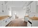 A spacious kitchen featuring white cabinets and butcher block countertops at 721 Ne 2Nd St, Ocala, FL 34470