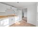 Bright kitchen features white cabinets, butcher block countertops, and new appliances at 721 Ne 2Nd St, Ocala, FL 34470