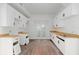 A kitchen with new white cabinets, butcher block countertops, and a double door leading outside at 721 Ne 2Nd St, Ocala, FL 34470