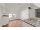 Kitchenette featuring butcher block counters and white cabinets with black hardware at 721 Ne 2Nd St, Ocala, FL 34470