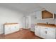 Kitchenette featuring butcher block countertops, white cabinetry, and stainless sink at 721 Ne 2Nd St, Ocala, FL 34470