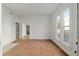 Living room with hardwood flooring, white walls, and natural light at 721 Ne 2Nd St, Ocala, FL 34470