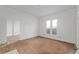 Living room featuring hardwood floors and white walls, with a window for natural light at 721 Ne 2Nd St, Ocala, FL 34470