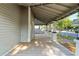 A spacious covered porch with wooden decking, offering a relaxing outdoor space with a neighborhood view at 721 Ne 2Nd St, Ocala, FL 34470
