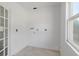 Unfinished room showcasing the potential for customization and a bright window view at 721 Ne 2Nd St, Ocala, FL 34470