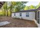 Home exterior showcasing a modest-sized backyard and natural landscaping at 7585 Sw 79Th Pl, Ocala, FL 34476