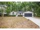 Charming single-story home features updated landscaping, attached garage, and inviting curb appeal at 7585 Sw 79Th Pl, Ocala, FL 34476