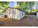 Home featuring a screened in porch and natural surroundings, creating a peaceful retreat at 7585 Sw 79Th Pl, Ocala, FL 34476