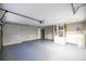 Spacious two car garage with freshly painted floors and walls, and plenty of storage space at 7585 Sw 79Th Pl, Ocala, FL 34476