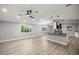 Open-concept living area boasts modern finishes, elegant lighting, and beautiful flooring at 7585 Sw 79Th Pl, Ocala, FL 34476