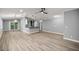 Spacious open-concept living area featuring modern lighting, flooring, and a stylish breakfast bar at 7585 Sw 79Th Pl, Ocala, FL 34476