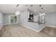 Bright open living space featuring modern fixtures, spacious breakfast bar, and access to back porch at 7585 Sw 79Th Pl, Ocala, FL 34476
