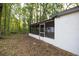 Screened-in porch offering a tranquil space to relax and enjoy the private outdoor surroundings at 7585 Sw 79Th Pl, Ocala, FL 34476