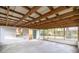 View of large screened in porch with metal roof and access to the backyard at 7585 Sw 79Th Pl, Ocala, FL 34476