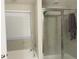 Well-maintained bathroom with a tub/shower combo featuring modern glass sliding doors at 807 Glen Creek Ct, Fruitland Park, FL 34731