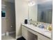 Bathroom featuring a dual vanity with granite countertops, providing ample space and style at 807 Glen Creek Ct, Fruitland Park, FL 34731