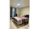 Comfortable bedroom with soft lighting, neutral walls, and a plush bed with decorative pillows at 807 Glen Creek Ct, Fruitland Park, FL 34731