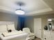 Bright bedroom with a ceiling fan/light fixture, neutral walls, and decor, creating a serene space at 807 Glen Creek Ct, Fruitland Park, FL 34731