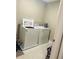 Functional laundry room with a full-size washer and dryer set, ready for everyday convenience at 807 Glen Creek Ct, Fruitland Park, FL 34731