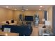 Comfortable living room featuring modern decor with mirrored display cabinets flanking a large television at 807 Glen Creek Ct, Fruitland Park, FL 34731