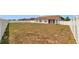 Spacious backyard enclosed by a white fence offering privacy and room for outdoor activities at 8127 Sw 60Th Ct, Ocala, FL 34476