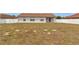 Exterior of the house and backyard, featuring a white fence for privacy and security at 8127 Sw 60Th Ct, Ocala, FL 34476