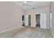Spacious bedroom featuring two closets and two doorways to the bathroom at 8127 Sw 60Th Ct, Ocala, FL 34476