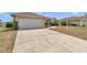 Charming single-story home features a well-maintained lawn, and a two-car garage at 8127 Sw 60Th Ct, Ocala, FL 34476