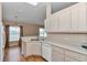 Kitchen features white dishwasher, cabinets, and stainless steel double sink at 8127 Sw 60Th Ct, Ocala, FL 34476