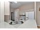 Functional kitchen with white cabinets, appliances, and ample counter space at 8127 Sw 60Th Ct, Ocala, FL 34476